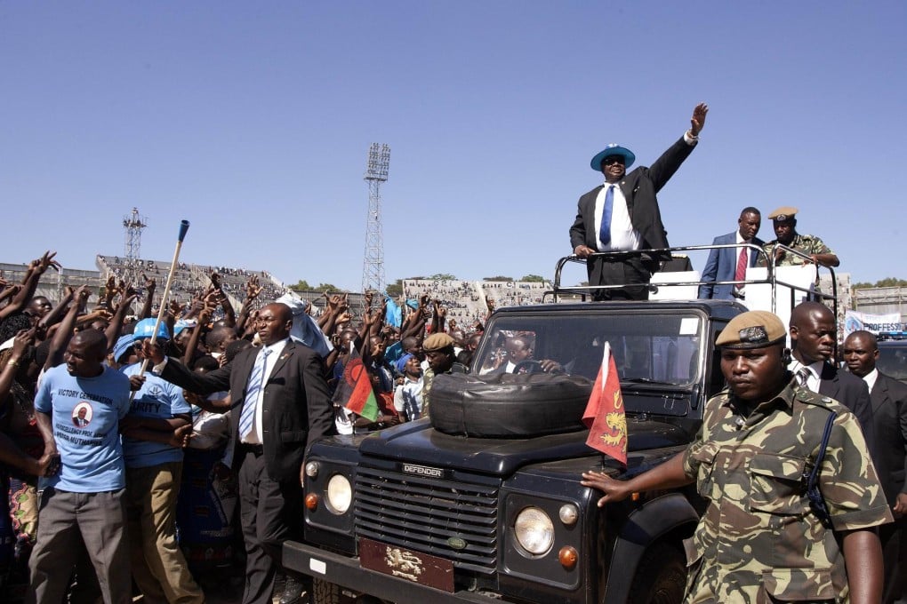 Peter Mutharika waves to the crowd at his inauguration in Blantyre, the commercial capital of one of the world's poorest nations. Photo: AFP