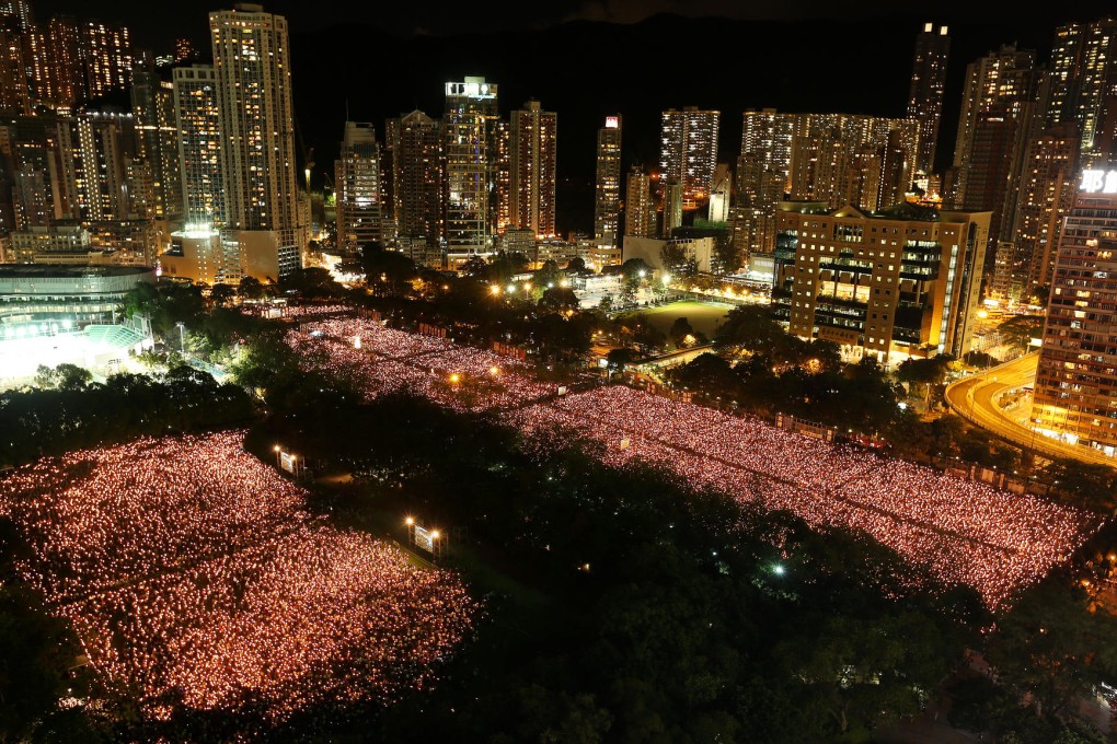 Victoria Park shines with a sea of candlelight during the vigil, which drew at least 99,500 people to markthe 25th anniversary of the Tiananmen crackdown. Photo: K. Y. Cheng