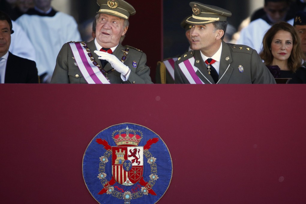 King Juan Carlos and his son, Crown Prince Felipe, at the awards ceremony yesterday. Photo: Reuters