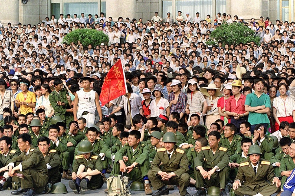 This file image taken on June 3, 1989 shows PLA soldiers and students in front of the Great Hall of the People at Tiananmen Square in Beijing. Photo: AFP