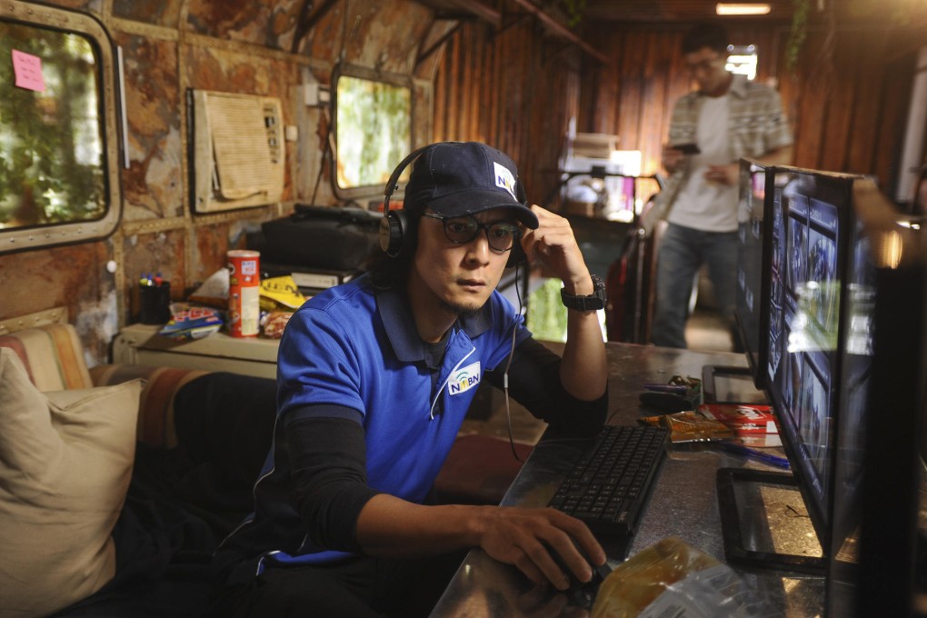 Daniel Wu in Overheard 3.