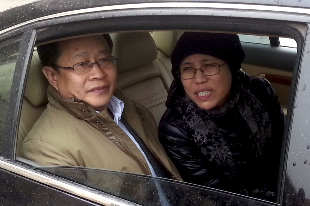 Mo Shaoping (left) with the wife of jailed Nobel laureate Liu Xiaobo, Liu Xia. Photo: AFP