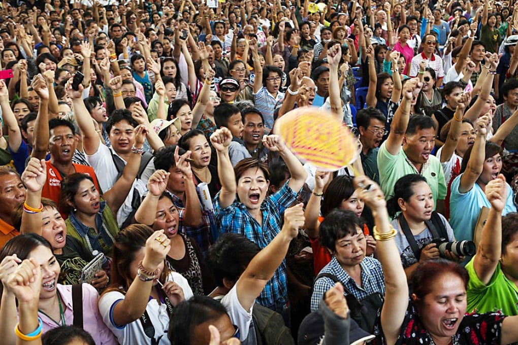 People react during a military event at the Victory Monument in Bangkok. Photo: Reuters