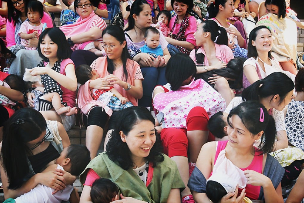 Breast-feeding mums mount a flash mob event to raise public awareness of equal treatment for breast-feeding in public spaces in Tsim Sha Tsui. Photo: Dickson Lee