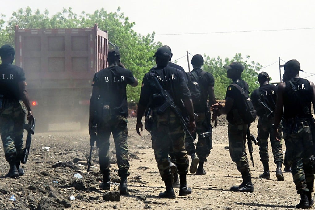 Armed Cameroonian men of the rapid intervention battalion (BIR) patrol in Waza, northern Cameroon. Boko Haram gunmen killed 35 people in attacks on three villages in Nigeria's restive northeast Borno state near the border with Cameroon. Photo: AFP