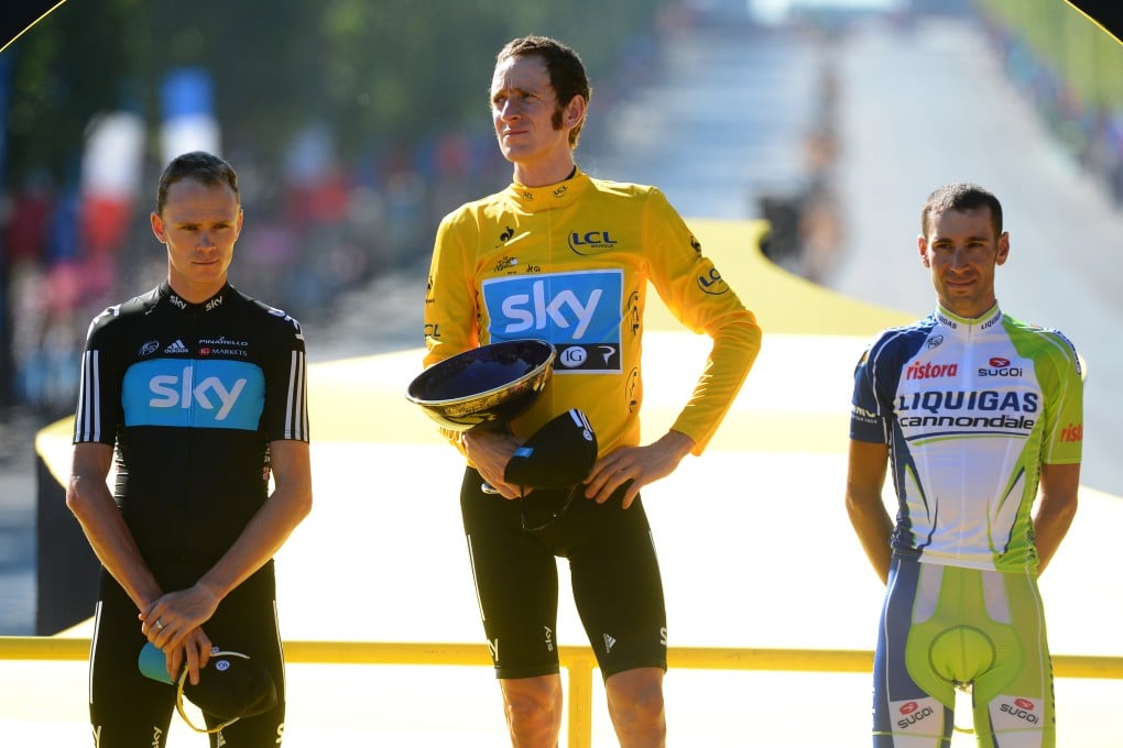 Wiggins (centre) and Chris Froome (left) on the 2012 Tour de France podium in Paris, where they came first and second in the general classification for Team Sky. Relations between them have soured somewhat since then. Photo: AP