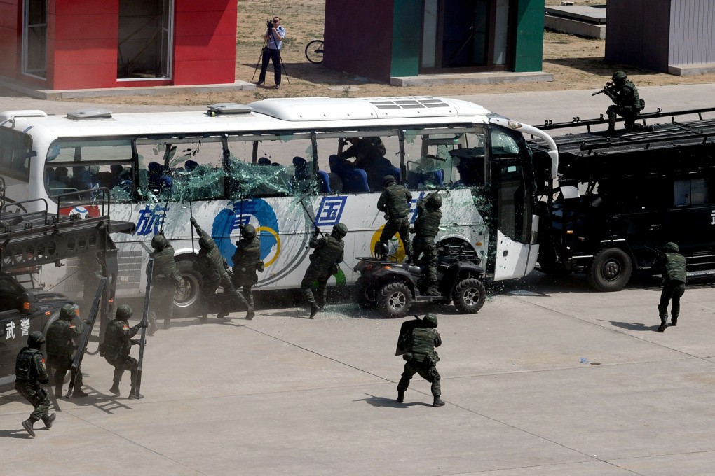 Police officers in Beijing demonstrate their skills at handling terror attacks in the wake of violence in Xinjiang. Photo: AFP