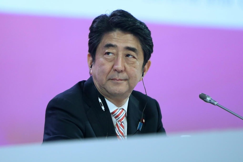 Shinzo Abe is under pressure to prove his policies can spur a sustained recovery after recent stock market falls. Photo: EPA