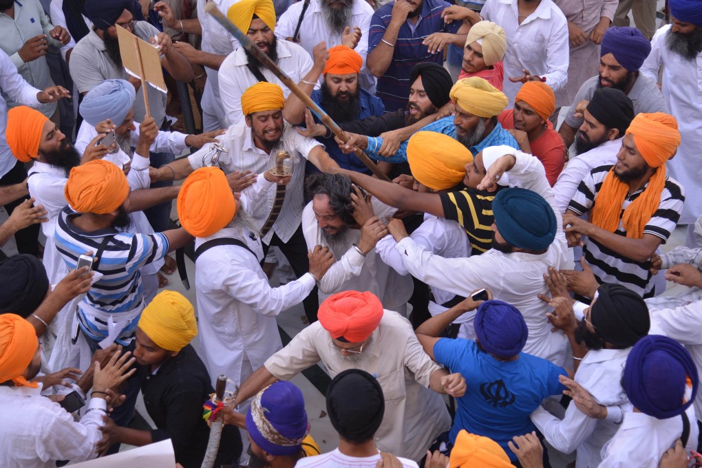 At least two people were wounded in the violence at the temple in the city of Amritsar, which is the holiest shrine in the Sikh religion. Photo: AFP
