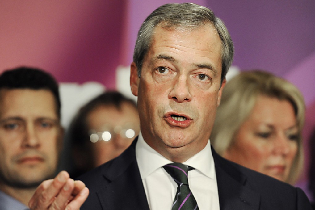 UK Independence Party (UKIP) leader Nigel Farage (centre) stands with his newly elected MEPs during a press conference in central London, Britain. Photo: EPA