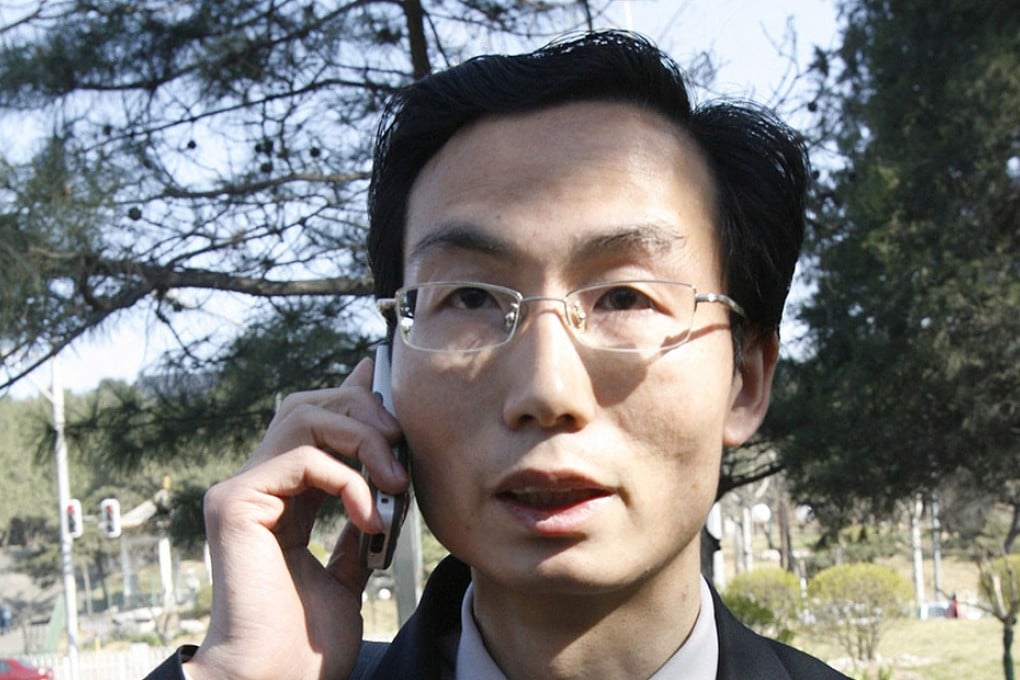 Rights lawyer Li Fangping talks on his phone outside the Beijing Number One Intermediate People's Court in this April, 2008 file picture. Photo: Reuters