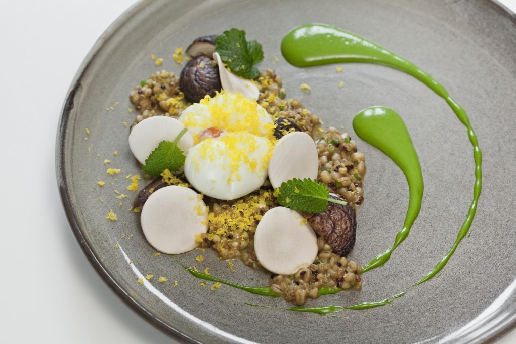 Slow poached Taiyouran egg and mushroom porridge, roasted shitake mushroom, garlic, chives and a cured egg yoke at NUR