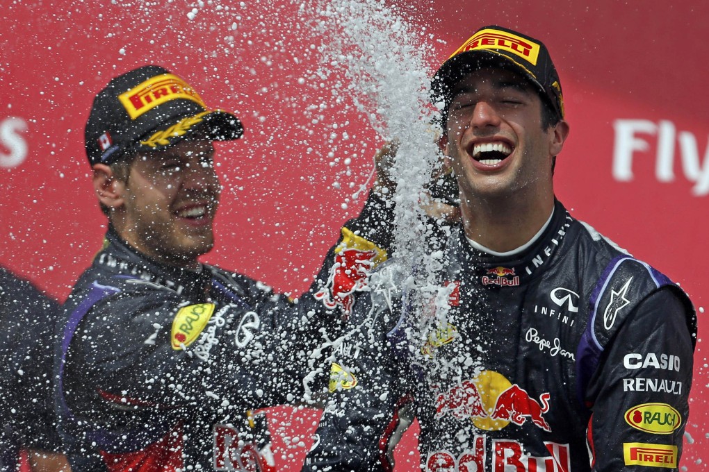 Daniel Ricciardo is sprayed with champagne by teammate Sebastian Vettel after winning the Canadian Grand Prix. Photo: AFP