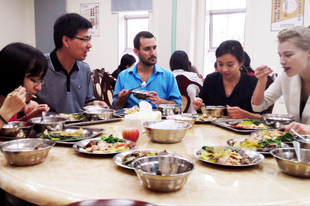 Nicolas Santo and Abby Heffer dine with colleagues.