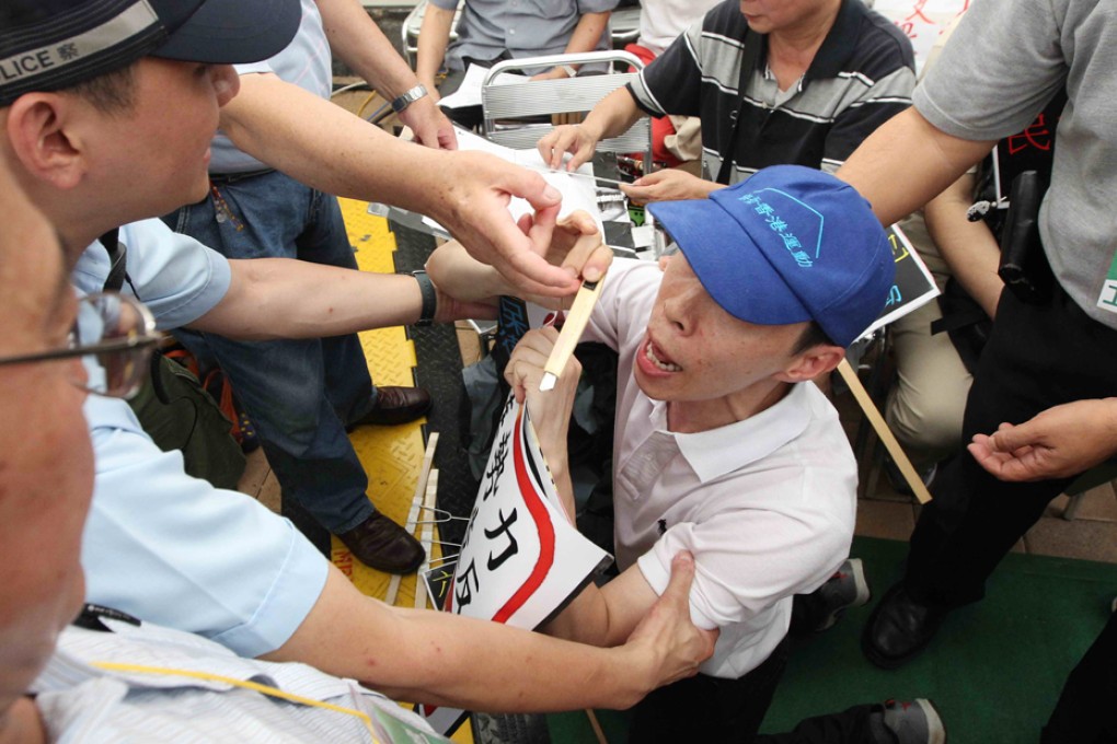 Members of Defend Hong Kong Campaign protest at City Forum in Victoria Park.