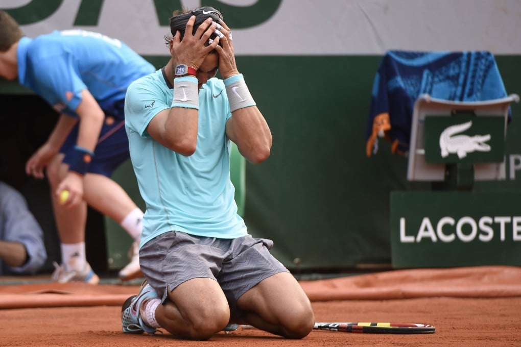 Rafael Nadal shows his relief on winning the French Open final at the Roland Garros stadium in Paris. Photo: AFP