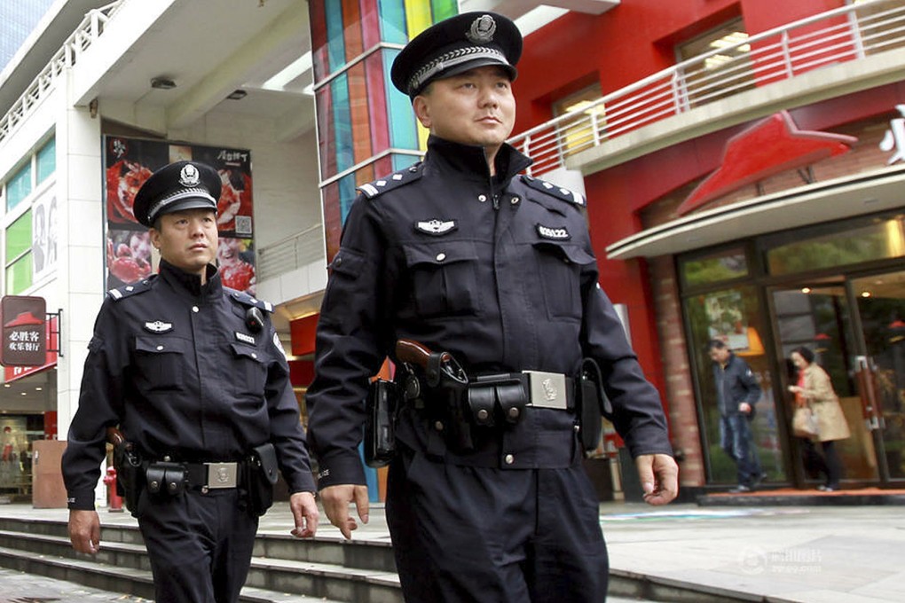 More than 1,000 policemen in Shanghai began carrying revolvers while on patrol in April as China tightens public security to deal with serious violent crimes. Photo: Xinhua