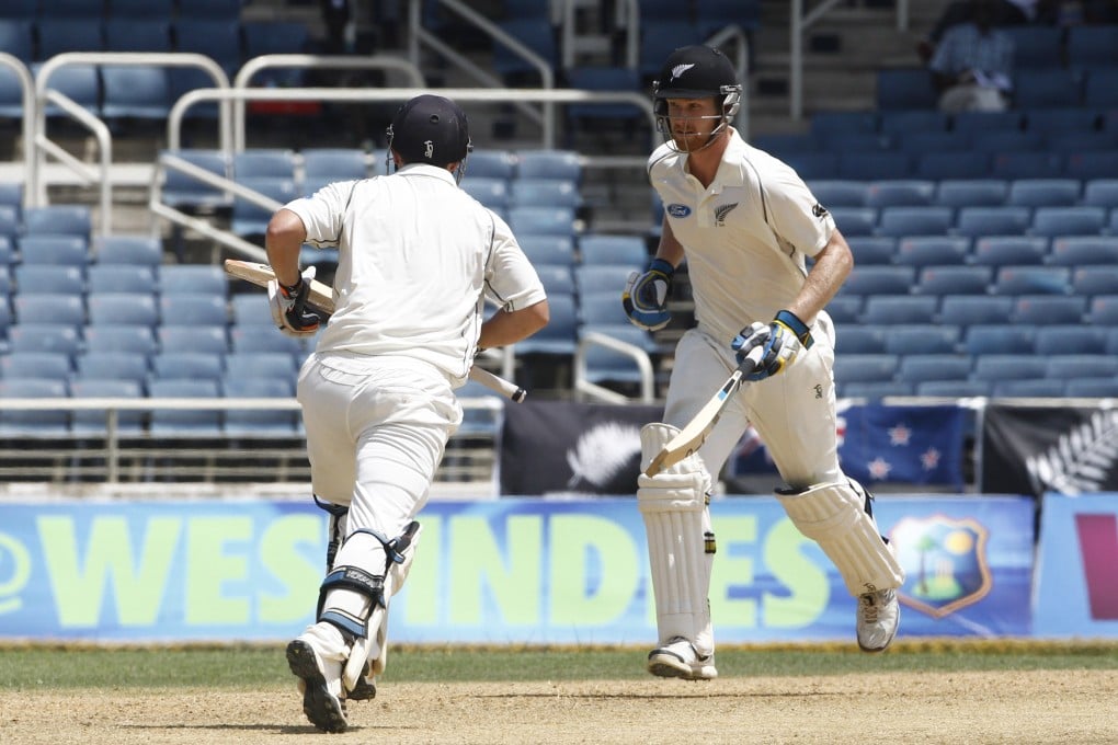 New Zealand batsmen BJ Watling (right) and Jimmy Neesham run between the wickets during the second day of their first test match against West Indies in Kingston. Photo: AP