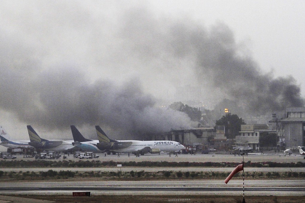 Smoke billows from Karachi's international airport yesterday after an attack by the Pakistan Taliban that left 28 people dead, including all 10 attackers. Photo: Reuters