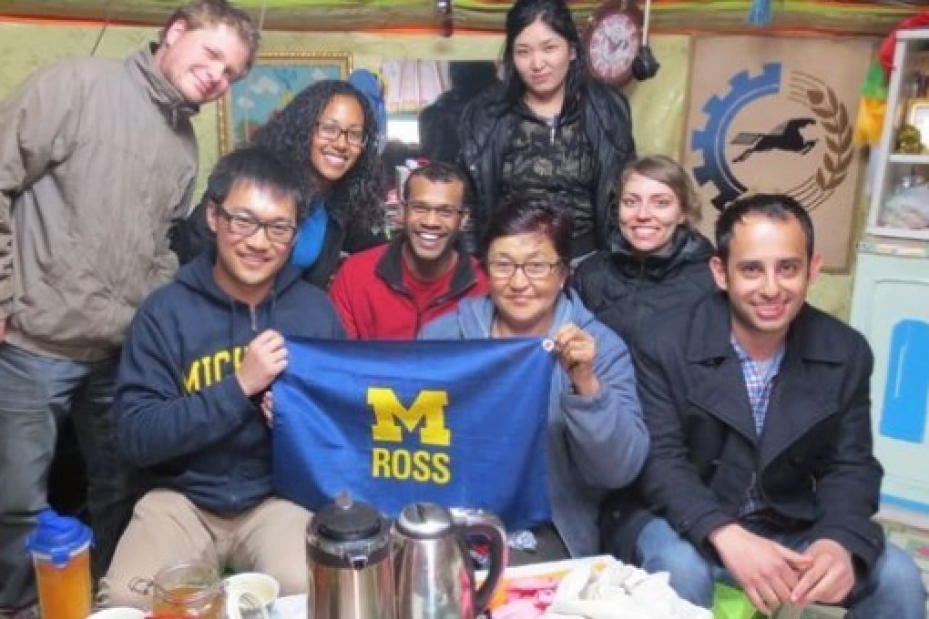 The Ross School of Business students pay a local Mongolian a visit to her yurk.by The Ross School of Business