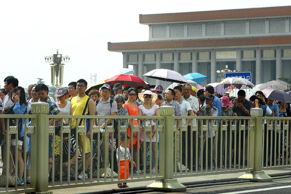Visitors queue up to enter Tiananmen Square in Beijing. The city is clamping down on queue-jumping ahead of the Apec forum. Photo: AFP