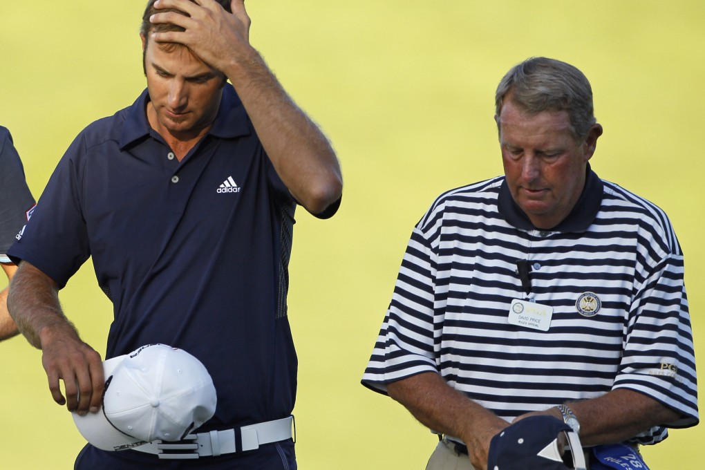Dustin Johnson (left) walks with rules official David Price on the 18th hole in the final round of the PGA Championship in 2010. Johnson was later given a two-stroke penalty for grounding his club in a bunker on the hole. Photo: AP