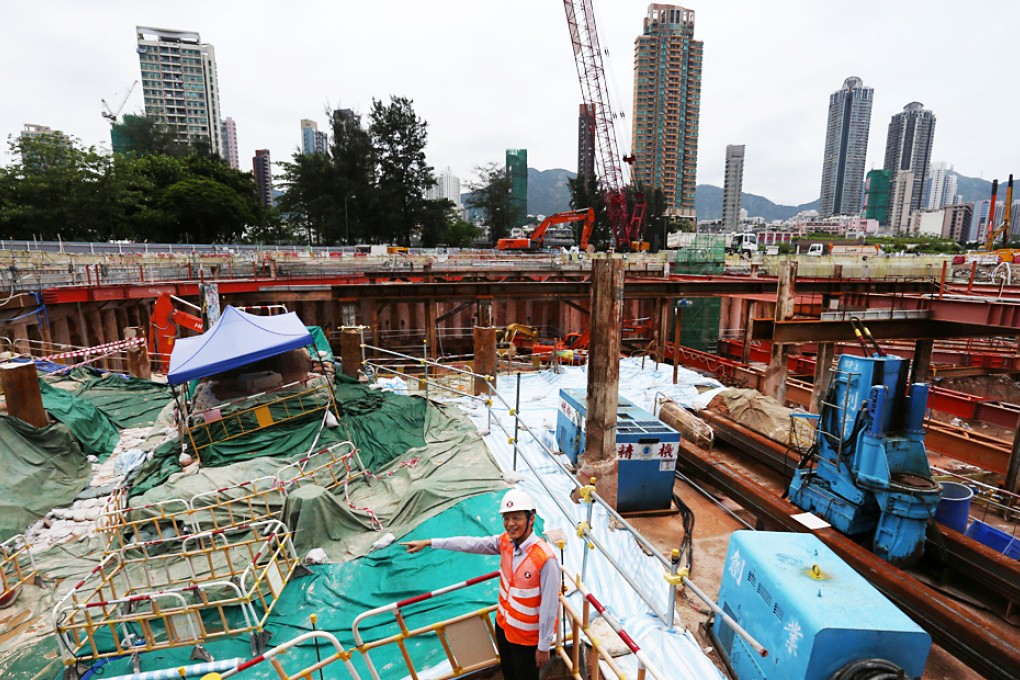 Peter Ip at the To Kwa Wan MTR site where the discovery of relics - covered by canvas and the blue canopy - has led to delay. Photo: Nora Tam