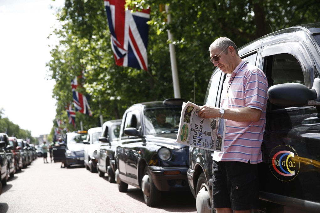 Smartphone apps, such as Uber or Lyft with their cheaper fares, may sound the death knell for London's iconic taxis. Photo: Bloomberg