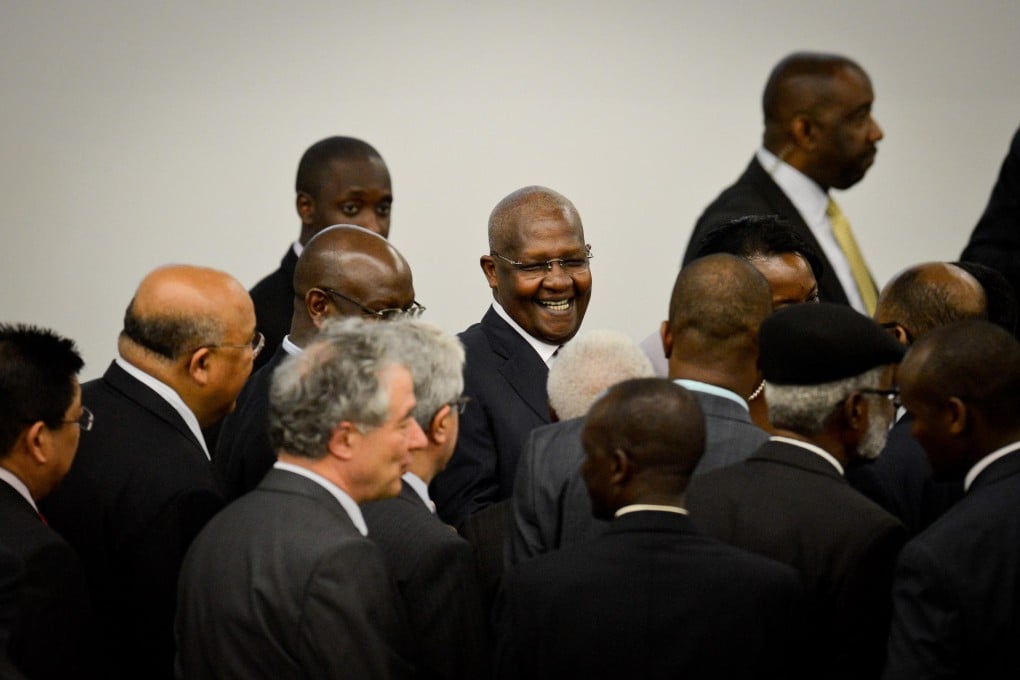 Sam Kutesa (centre) has been accused of corruption and of supporting his country's notoriously fierce anti-gay law. Photo: Xinhua