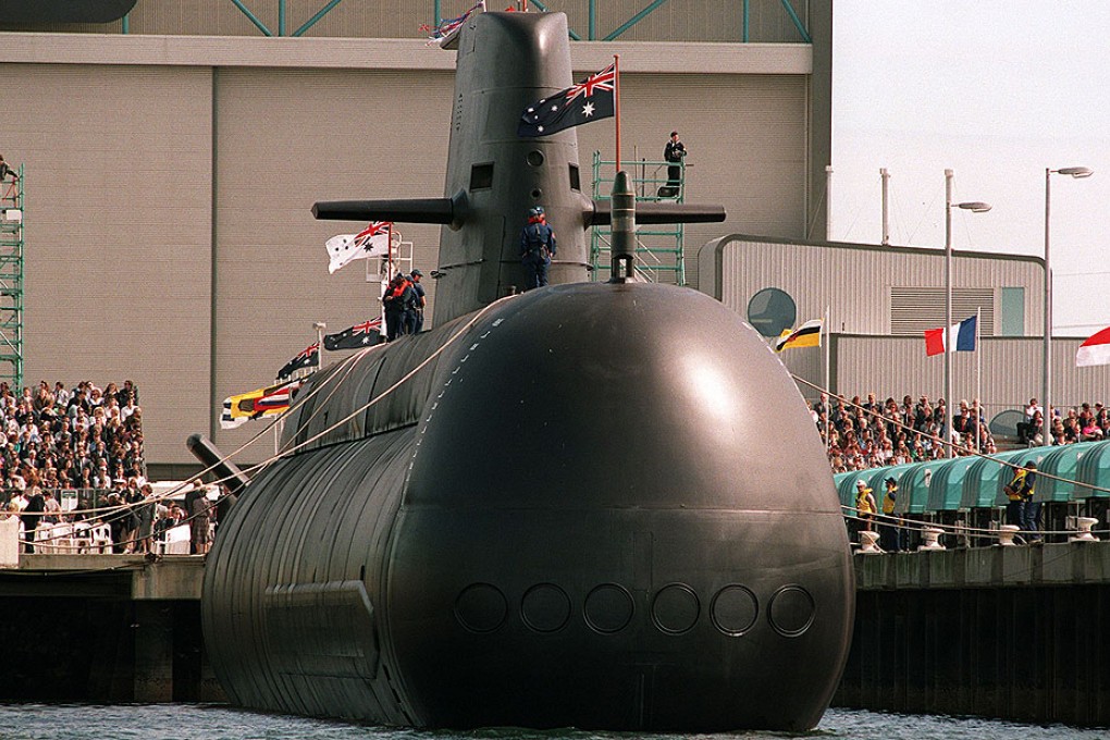 This file photo shows Australia's first high-tech Collins-class submarine being lowered into the water at Port Adelaide. Photo: AFP