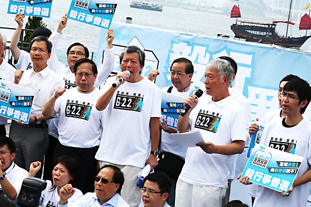 Pan-democractic groups announce a week-long campaign to march 140km across the city on Saturday to urge Hongkongers to vote in Occupy Central's unofficial "referendum". Lawmaker Lee Cheuk-yan (holding microphone) is one of the event organisers. In the June 20-22 vote, Hongkongers will choose from three electoral reform proposals. Photo: Felix Wong