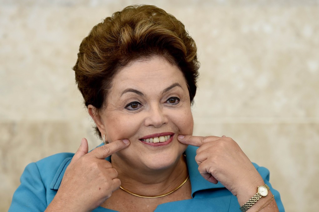 Dilma Rousseff has rounded on the "pessimists" and urged Brazil to get behind the World Cup. Photo: AFP