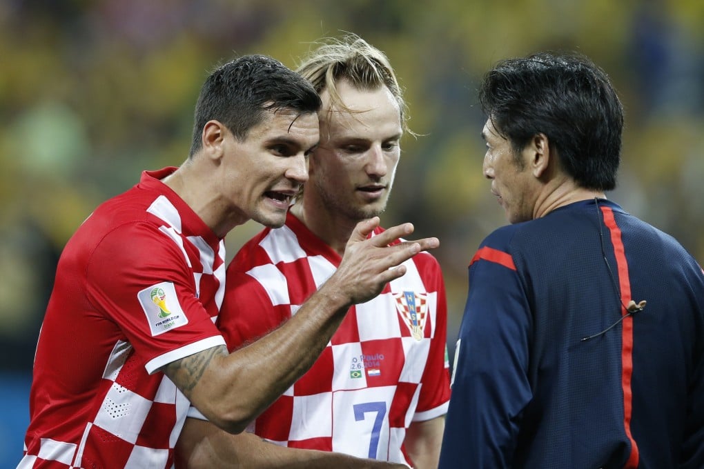 Croatia's Dejan Lovren (left) and Ivan Rakitic remonstrate with referee Yuichi Nishimura after the penalty award. Photo: AFP