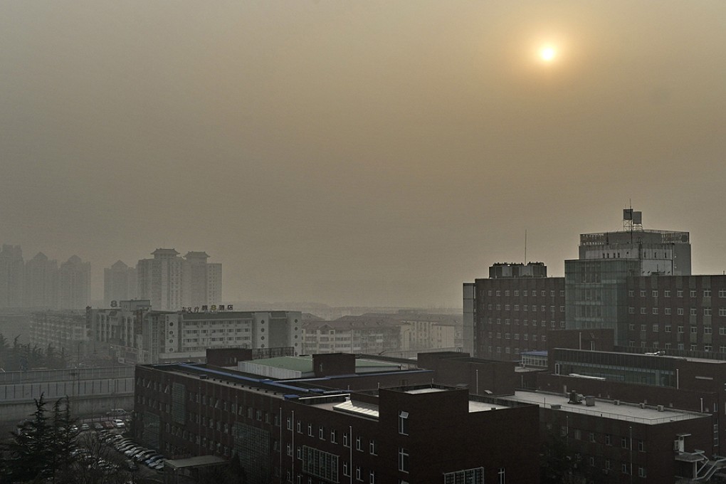 Buildings blanketed in heavy smog in the capital as the Beijing municipal government issued a yellow smog alert earlier this year. Photo: Xinhua