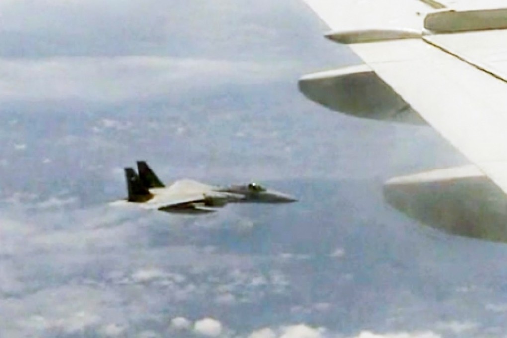 A screenshot showing a Japanese fighter jet following a Chinese military plane. Photo: SCMP