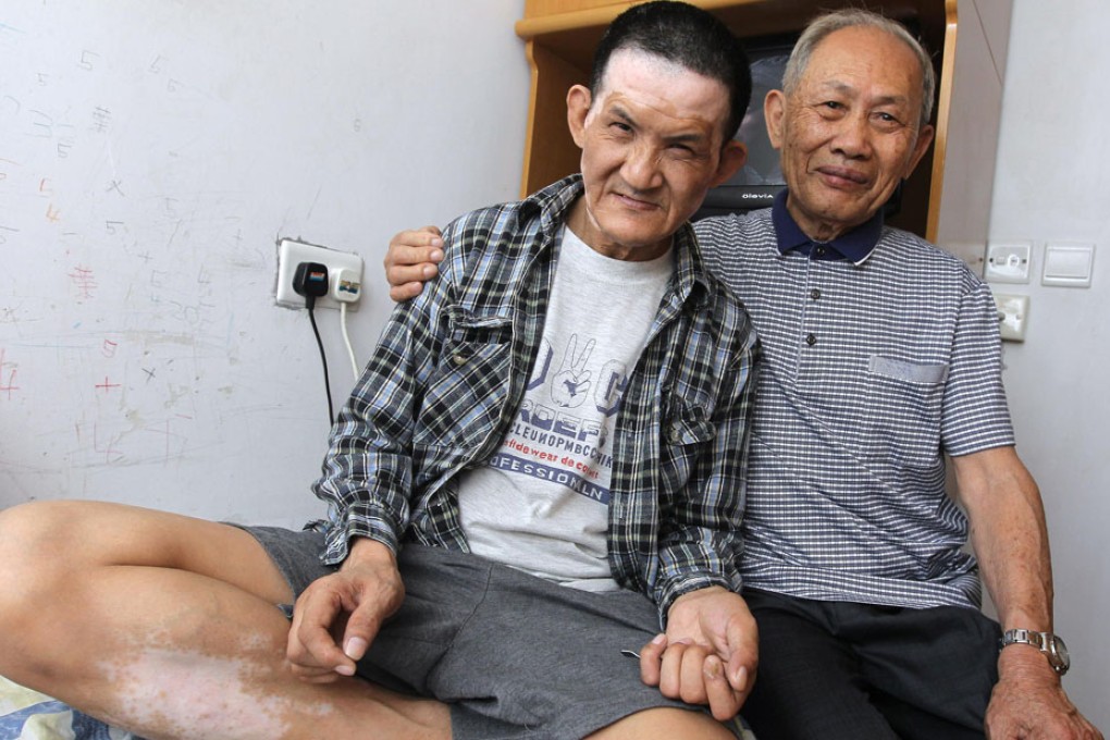 Doting dad Yip Kie-chun has sacrificed everything to care for his mentally disabled son Yip Chi-wo. For Yip, a smile from his son is all he wants on Father's Day. Photo: Edward Wong