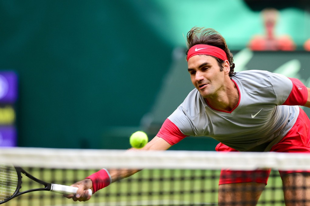 Roger Federer returns to Japan's Kei Nishikori in their semi-final match in Halle. Photo: EPA