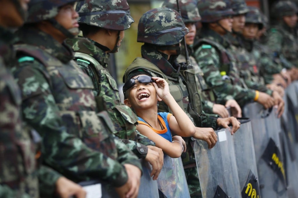 Soldiers block a road near the Victory Monument in Bangkok, to prevent protesters from rallying against the coup. Photo: EPA
