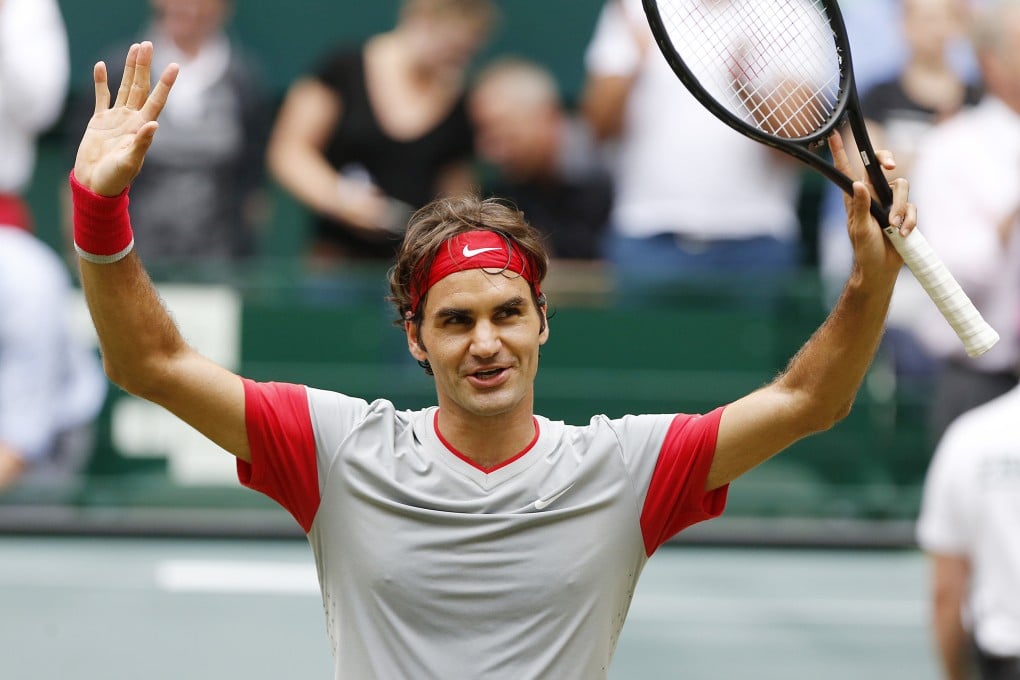 Switzerland's Roger Federer celebrates after winning the Halle Open in Germany. Photo: AP