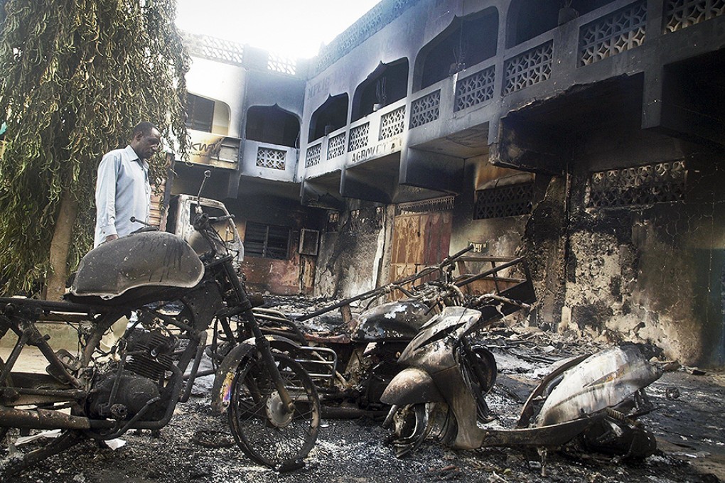 The extremists set two hotels on fire and sprayed bullets into the street killing dozens. Photo: AP