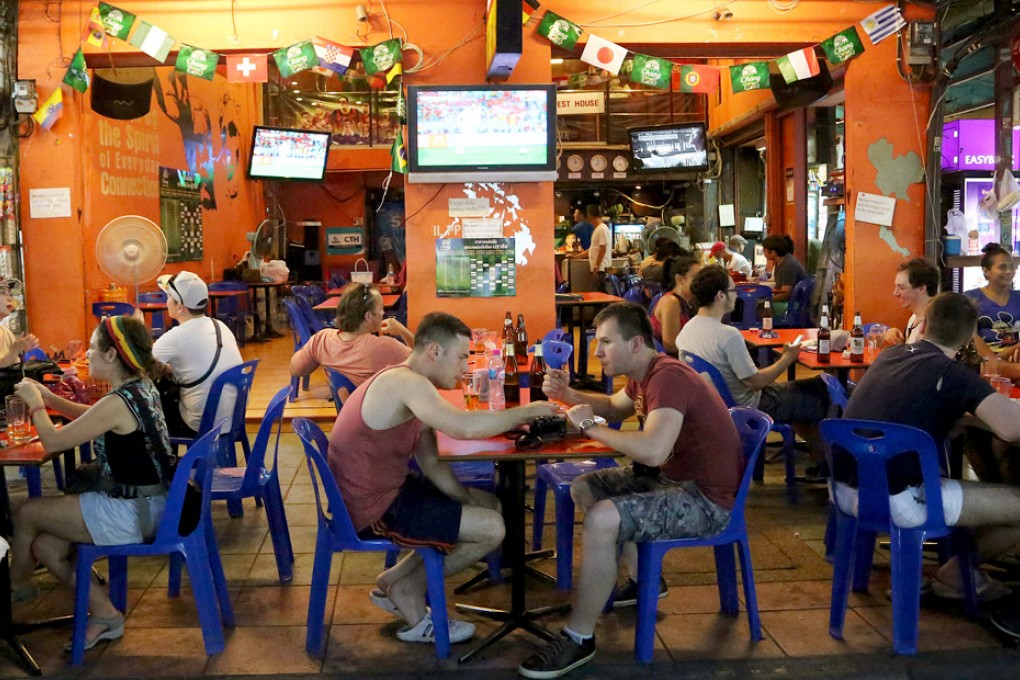 Tourists and locals dine in a restaurant in Khao San Road. Photo: AP