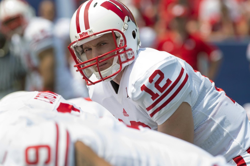 Kevin Costner is determined to snag a quarterback played by Josh Spence (above).