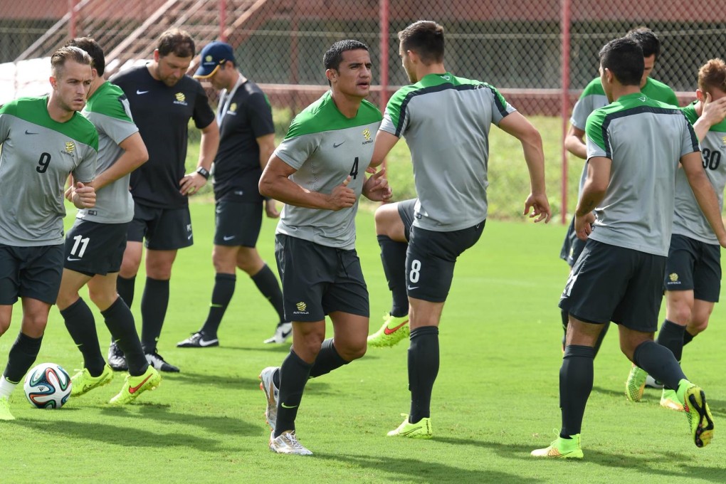 Australia’s forward Tim Cahill (centre) jogs with teammates at their training ground in Vitoria, Brazil, ahead of their second match in Porto Alegre. Photo: AFP