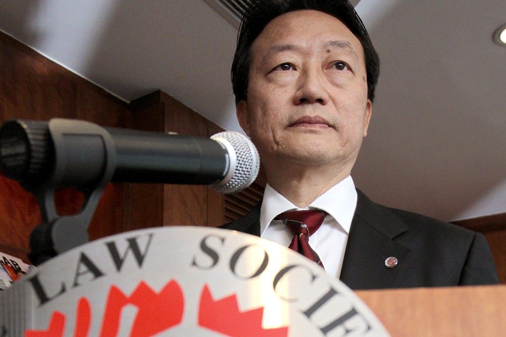 Law Society president Ambrose Lam San-keung (left) announces the society's verdict on the white paper on Monday. Photo: Dickson Lee