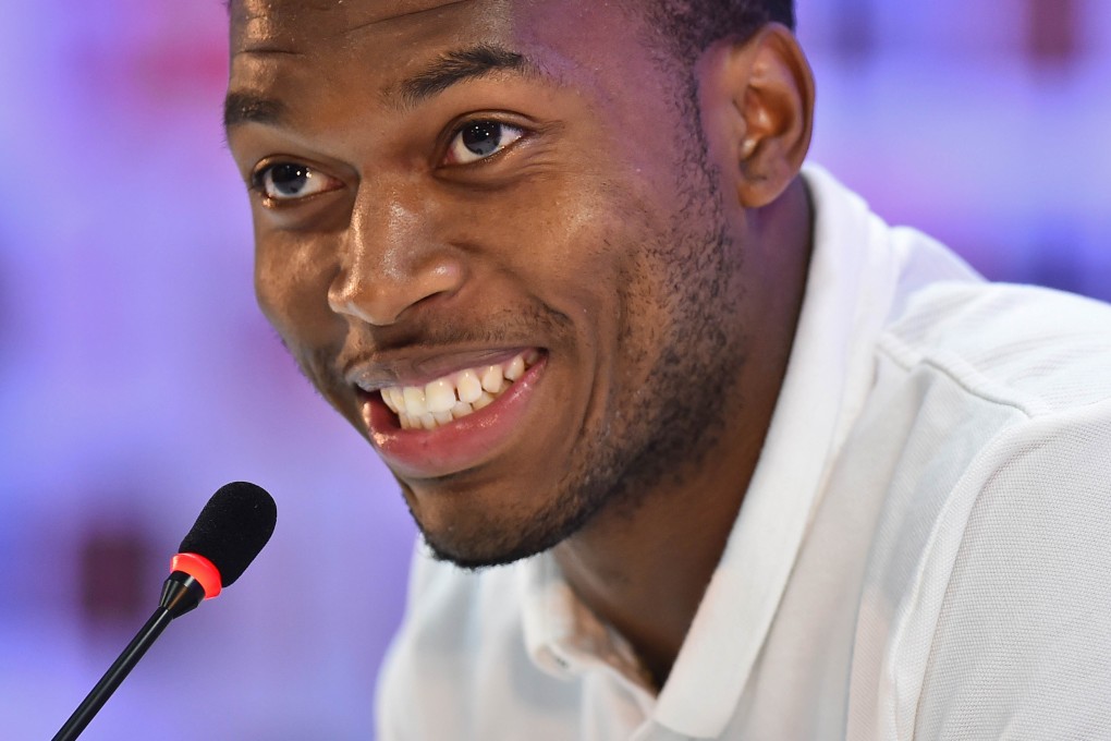 Daniel Sturridge smiles during a press conference. Photo: AFP