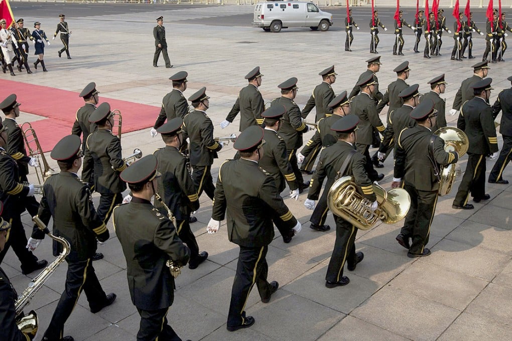The People's Liberation Army's honour guards and a marching band perform in Beijing earlier this month. Photo: EPA