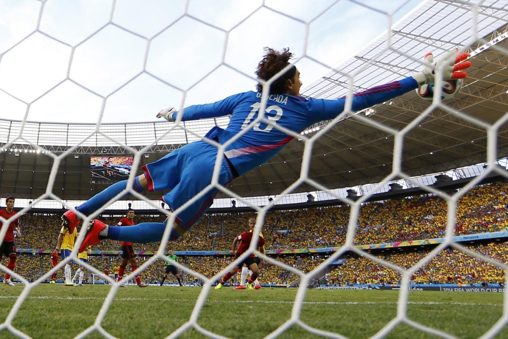 Mexico's goalkeeper Guillermo "Memo" Ochoa makes a miraculous save, at full stretch, from the shot of Brazil's striker Neymar at the Castelao arena in Fortaleza. Photo: Reuters