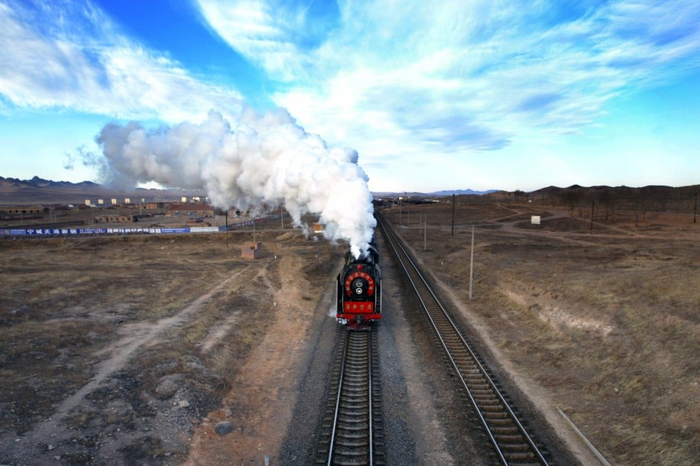A steam locomotive leaves a railway station in Daban, Inner Mongolia. Photo: Reuters
