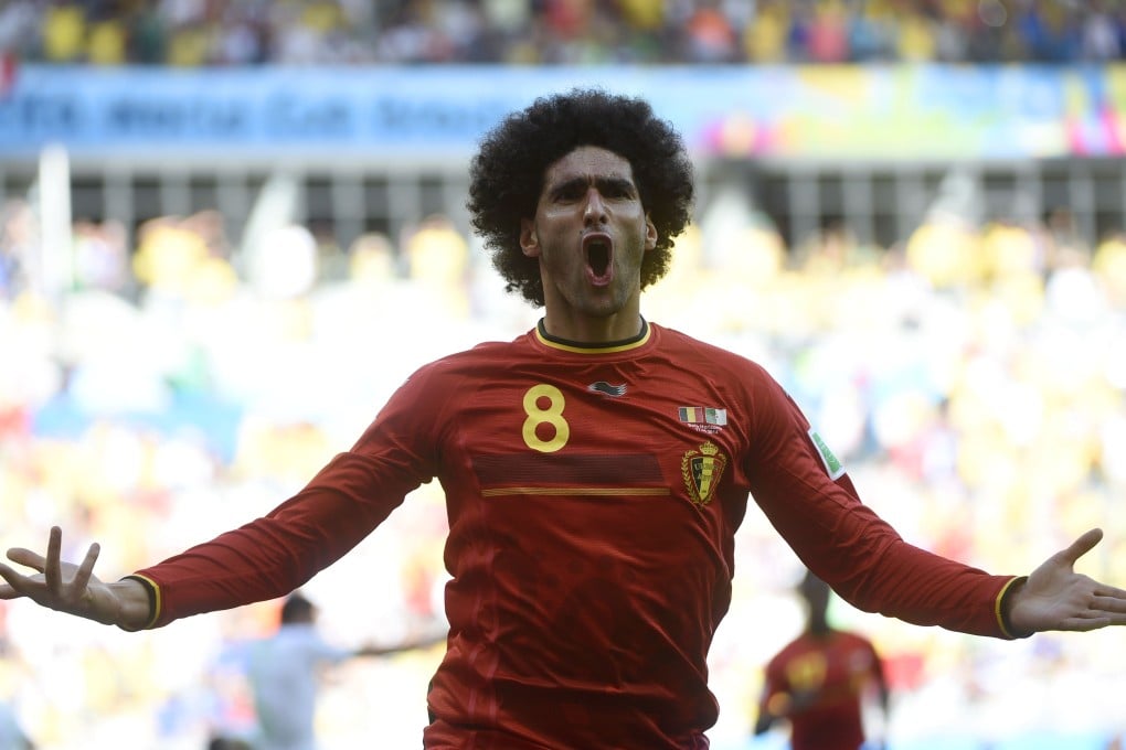 Belgium midfielder Marouane Fellaini makes a big impact with the equaliser against Algeria in their group H match. Photo: AFP