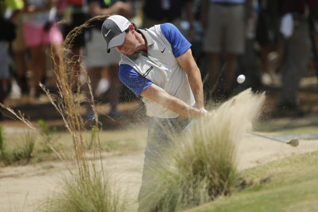 Rory McIlroy, seen here hitting from some shrubbery at last week's US Open, will represent Ireland at the 2016 Olympics in Rio. Photo: AP